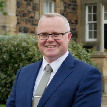 estate-agent-portrait-smiling-outside